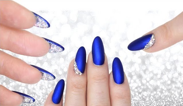 matte blue nails with crystals underneath
